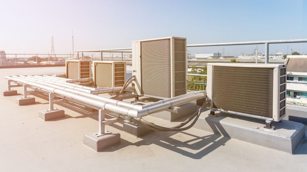 There Are a Lot of Air Conditioners on the Roof of a Building — Hutchy's Refrigeration & Electrical in Torres Strait, QLD