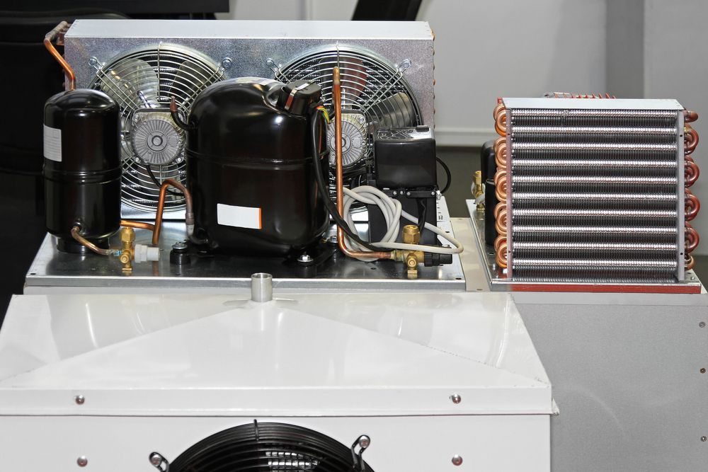 A Refrigerator With a Compressor, Fan, and Evaporator — Hutchy's Refrigeration & Electrical in Trinity Park, QLD