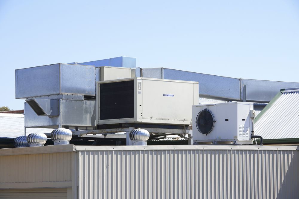 Rooftop Hvac Units With Metal Ductwork — Hutchy's Refrigeration & Electrical in Weipa, QLD