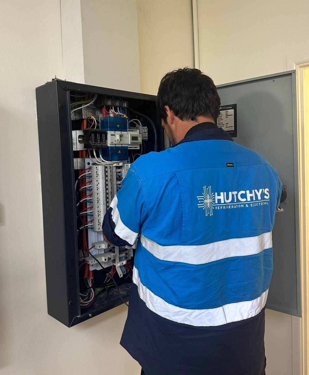 Man in Blue Work Shirt — Hutchy's Refrigeration & Electrical in Edmonton, QLD