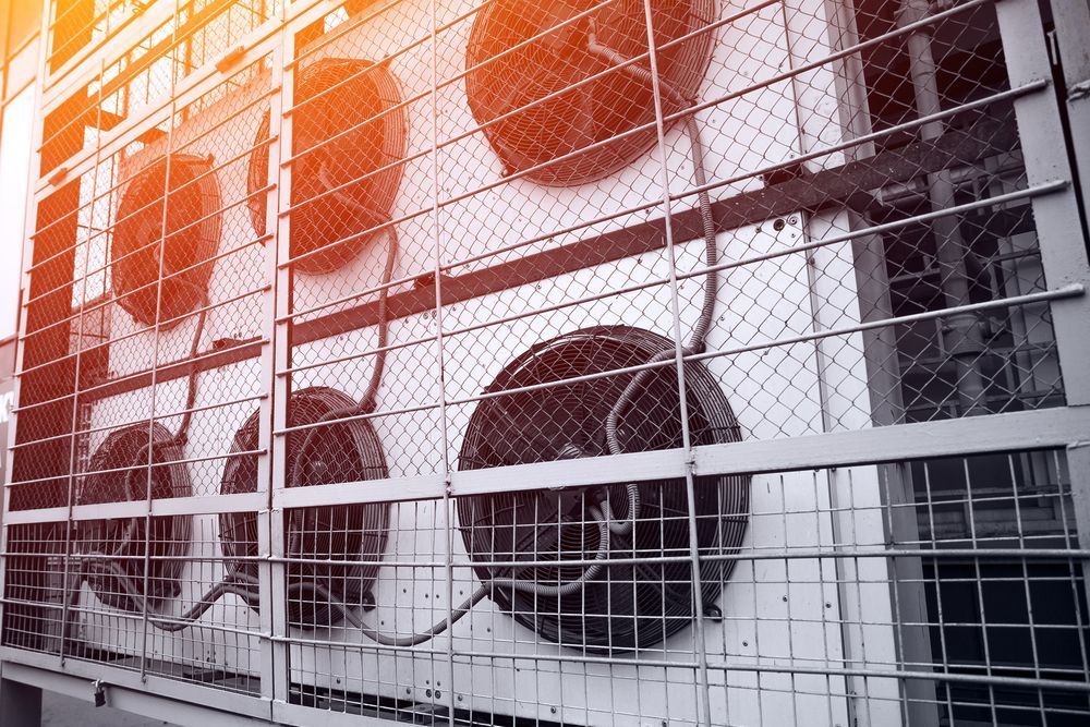 There are a lot of fans on the side of a building — Hutchy's Refrigeration & Electrical in Northern Beach Cairns, QLD