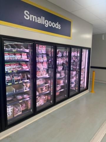Refrigerated display case labeled 