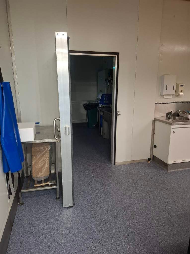 A Room With a Lot of Shelves and Boxes in It — Hutchy's Refrigeration & Electrical in Trinity Park, QLD