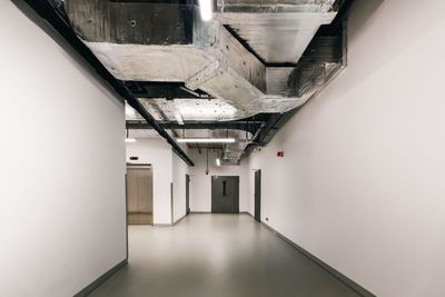 Interior construction site with circular ceiling design and columns.