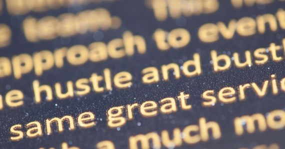 A close up of the word hustle on a piece of paper