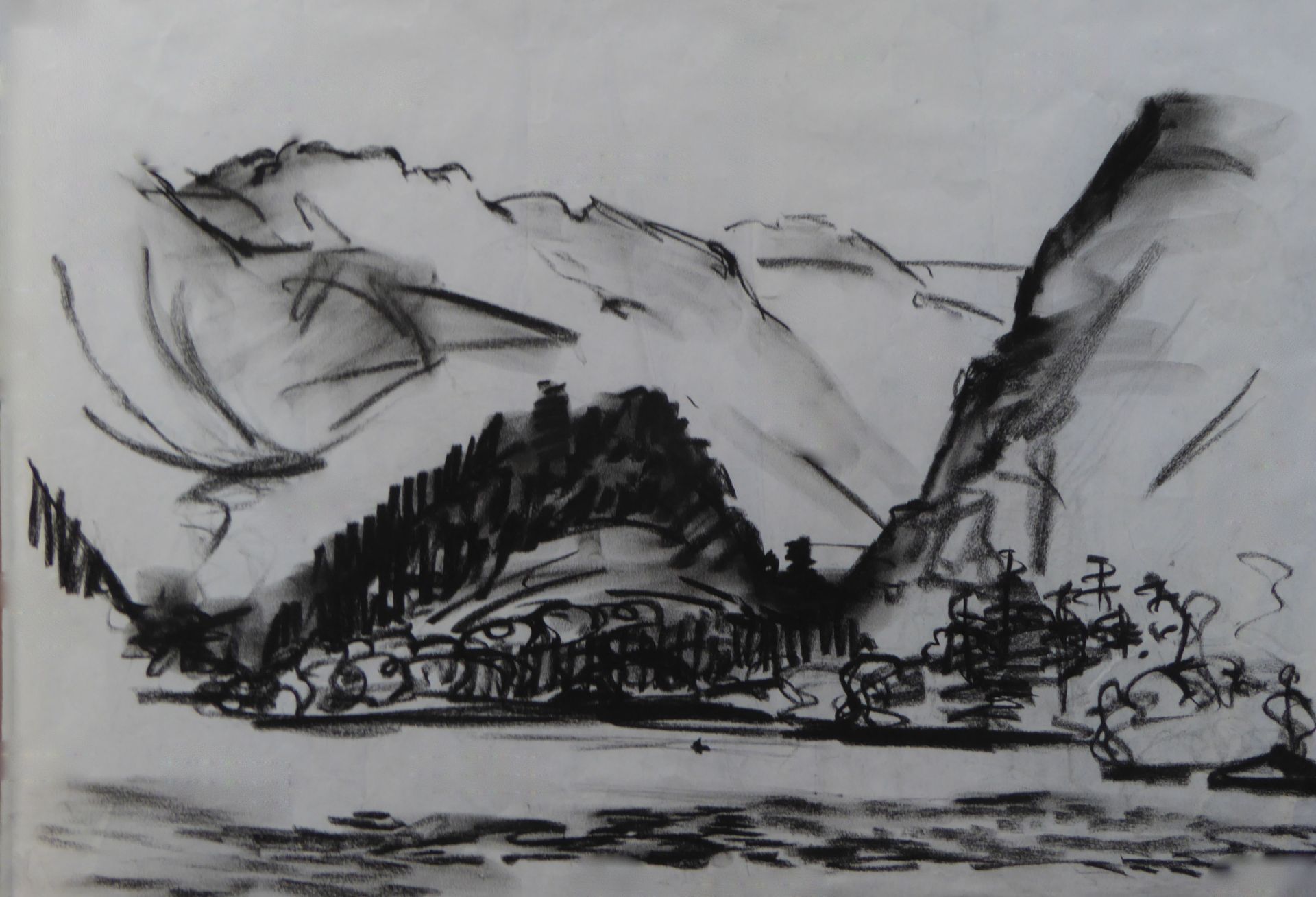 A black and white drawing of mountains and trees
