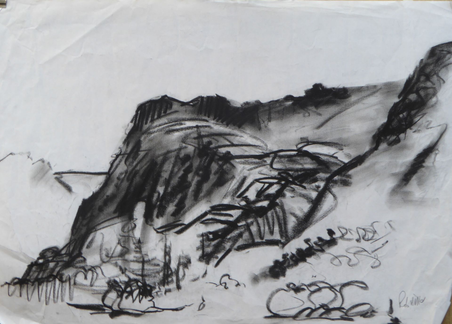 A black and white drawing of a rocky cliff