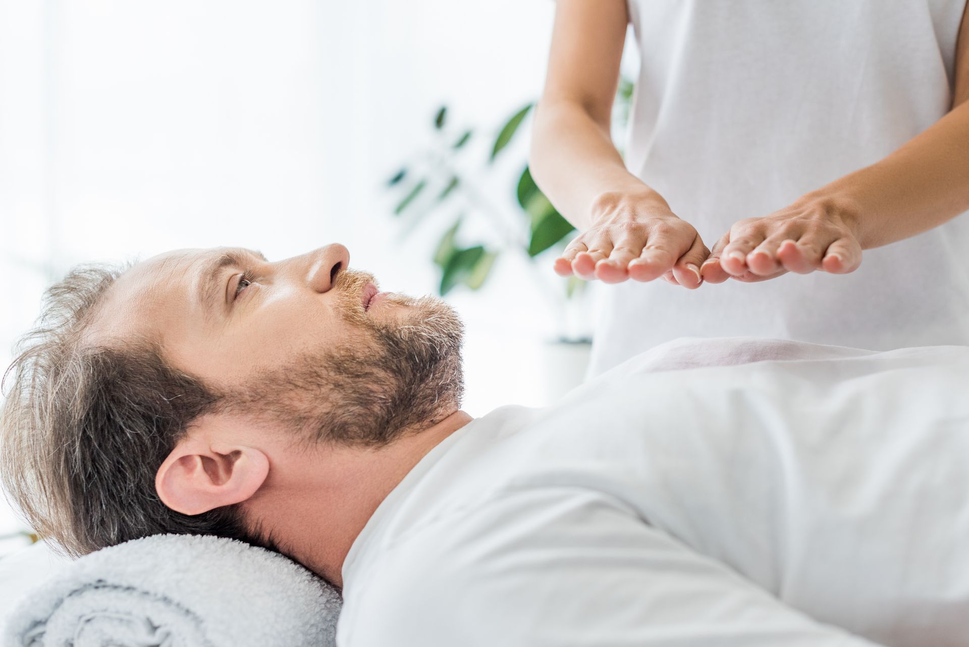 a man is getting a massage from a woman in a spa .