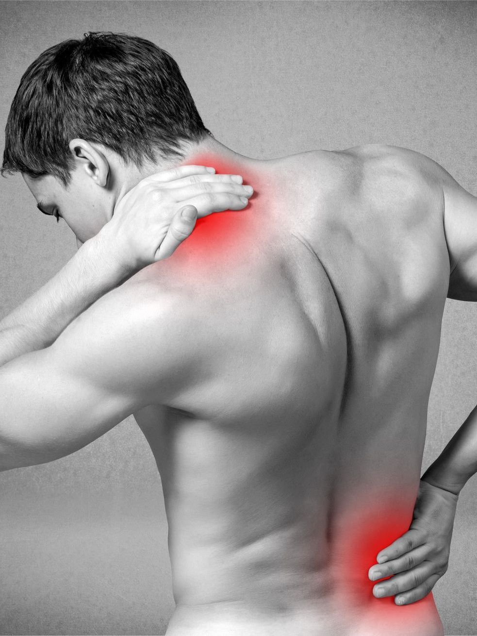 a man is holding his neck and back in pain