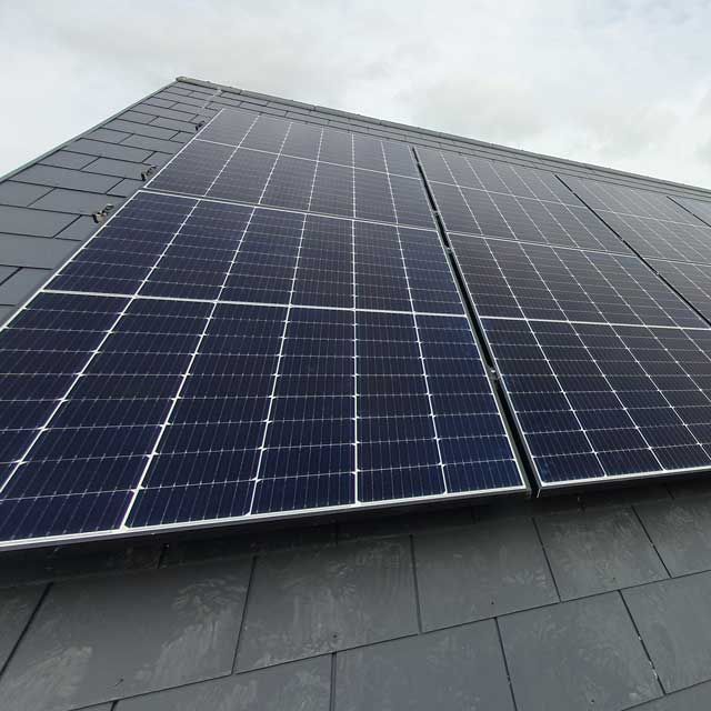 A roof with a lot of solar panels on it