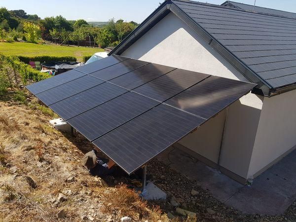 A house with solar panels on the side of it