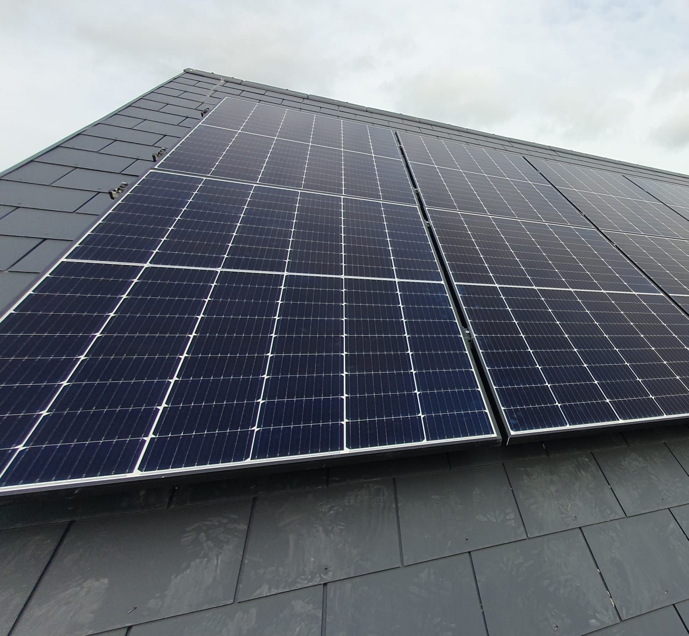 A roof with a lot of solar panels on it