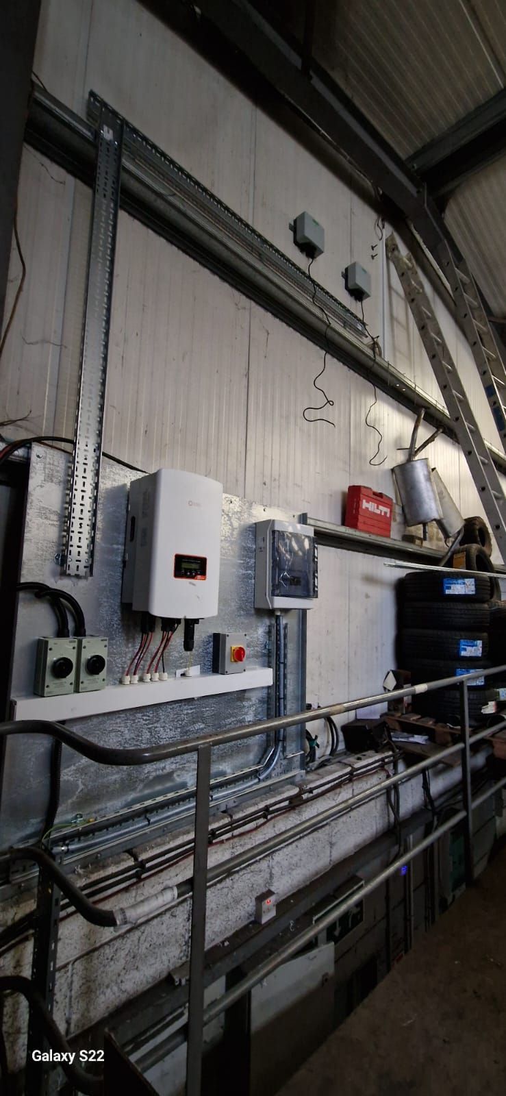 A warehouse with a lot of electrical equipment on the wall.
