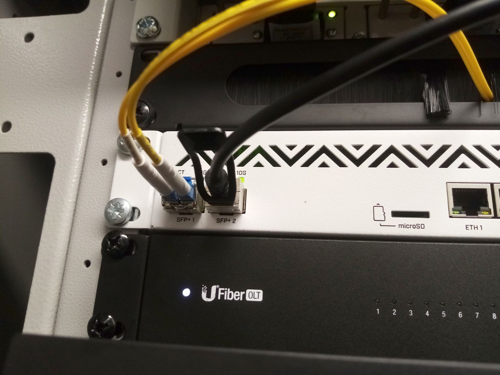 A person is cutting wires with a pair of pliers.