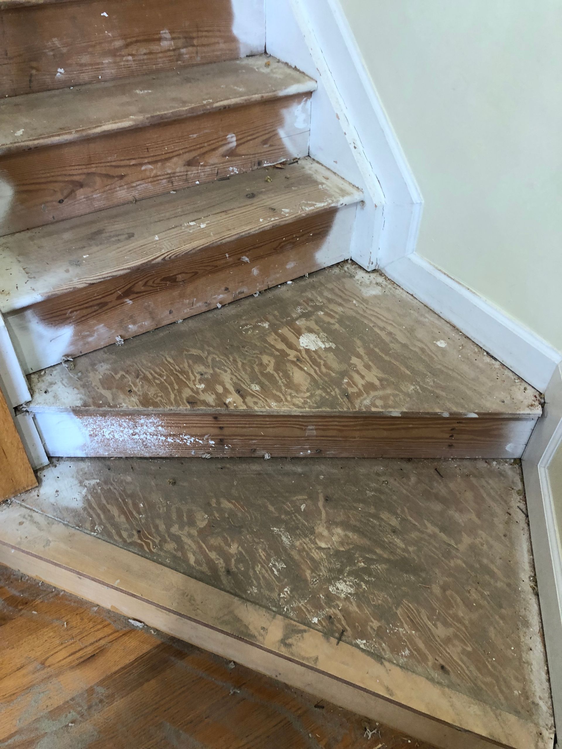 A close up of a wooden staircase ready to install hardwood stairs.
