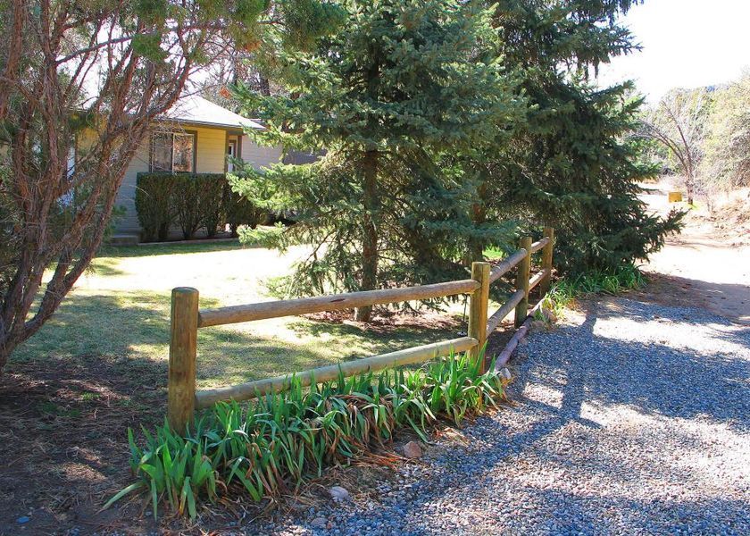 A house with a wooden fence in front of it