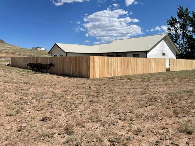 A house with a wooden fence