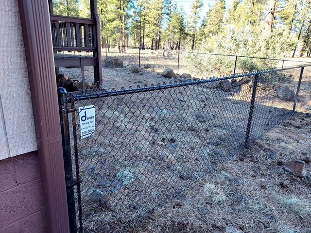 A close up of a chain link fence in a park