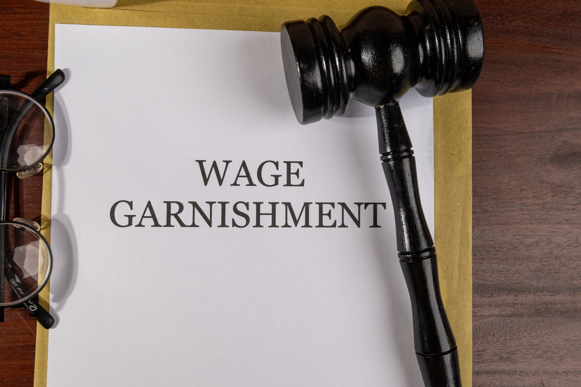 Wage Garnishment Legal Documents on Desk.