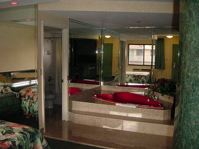 Theme Family Hotel in FL — Bathroom with Red Tub in Miami, FL
