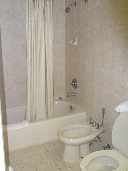 Family Hotel in FL — Toilet Bowl in Bathroom in Miami, FL