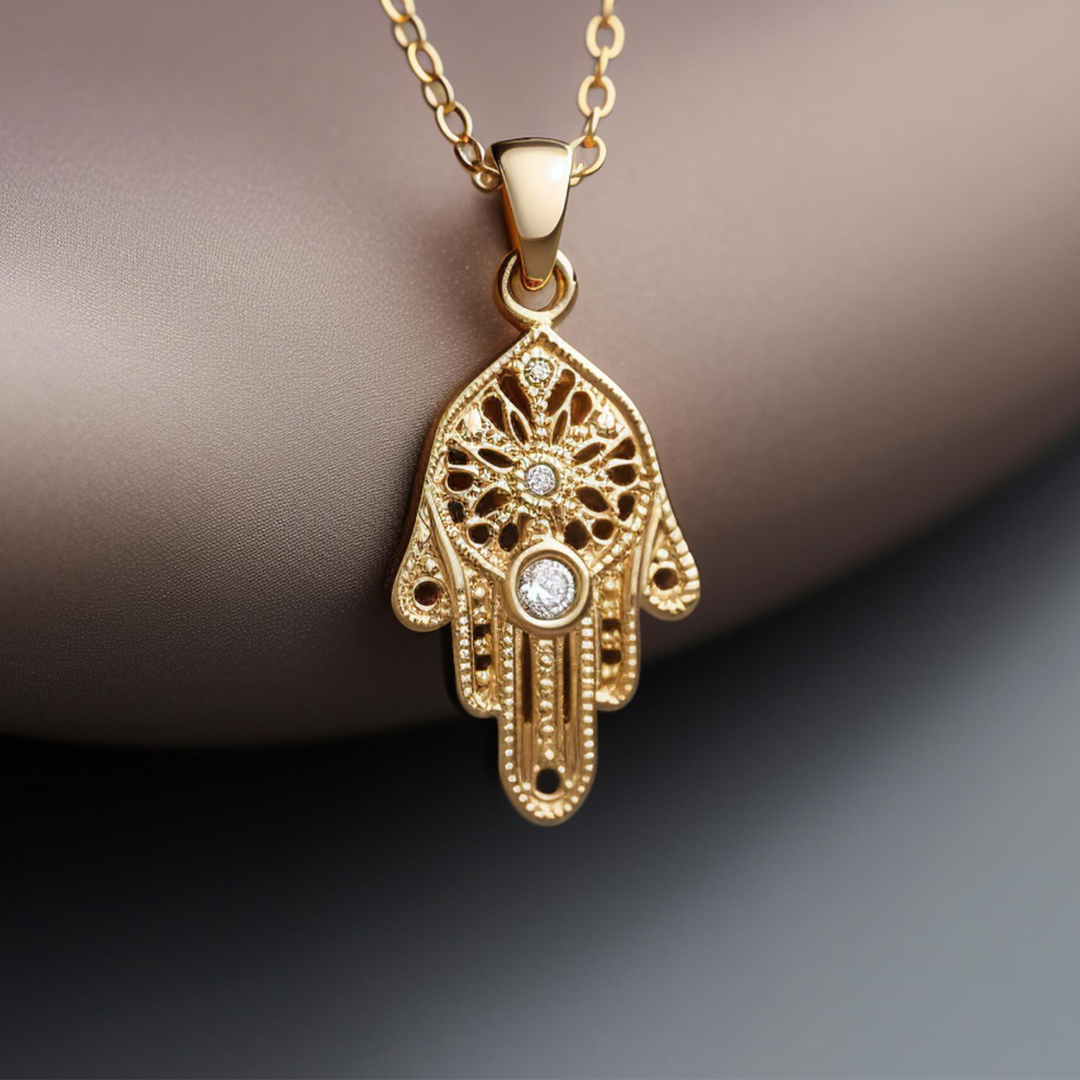 Gold hamsa necklace with a diamond in the center The Golden Corner Jewelry