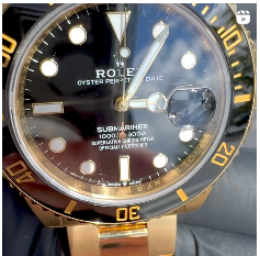 A close up of a rolex submariner watch