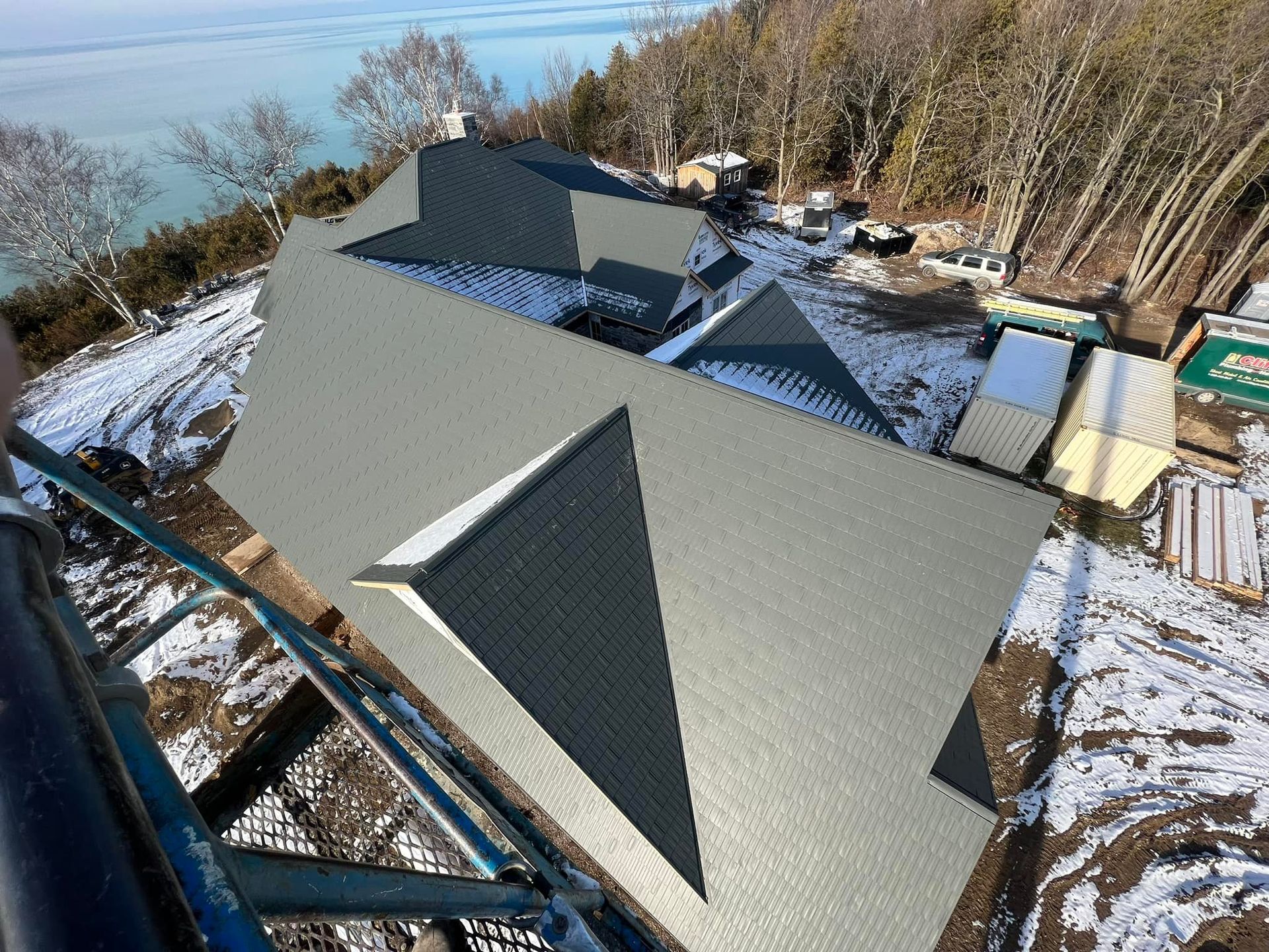 An aerial view of a house with a pyramid shaped roof.