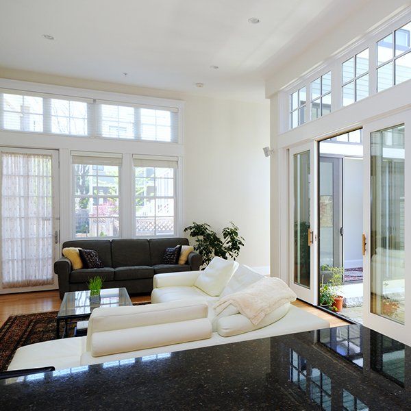 Man Spraying Blown Fiberglass Insulation — Jacksonville, FL — Preservation Home Specialists