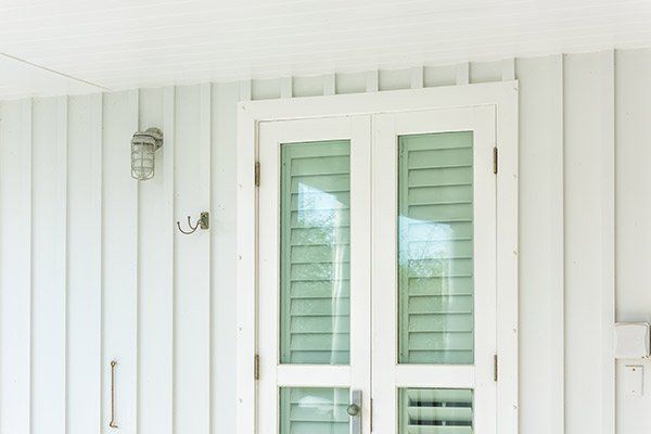 Pastel Green Colorful Window Shutters — Jacksonville, FL — Preservation Home Specialists