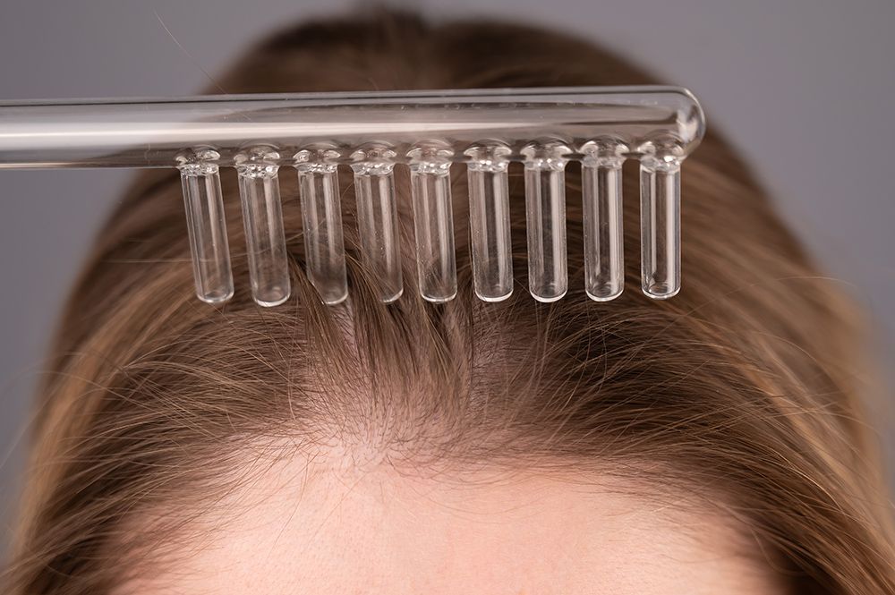 a close up of a person with a comb on their head
