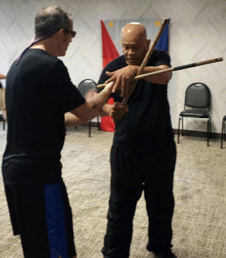 Grandmaster Bobby Taboada training Guro Robert Grossman in Balintawak Eskrima counter-to-counter dri