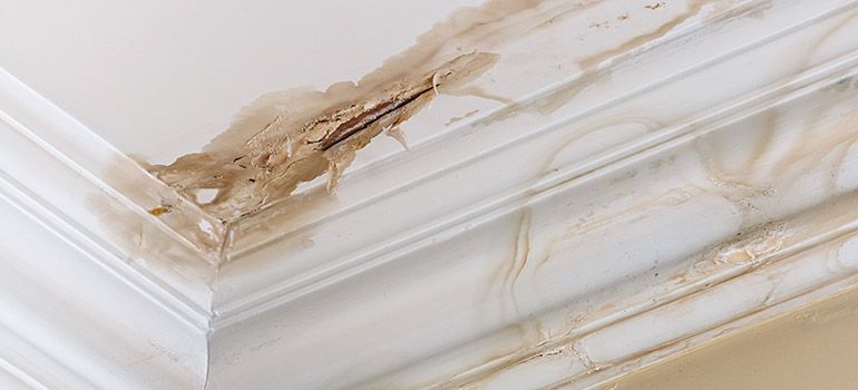 A close up of a ceiling with water damage on it.