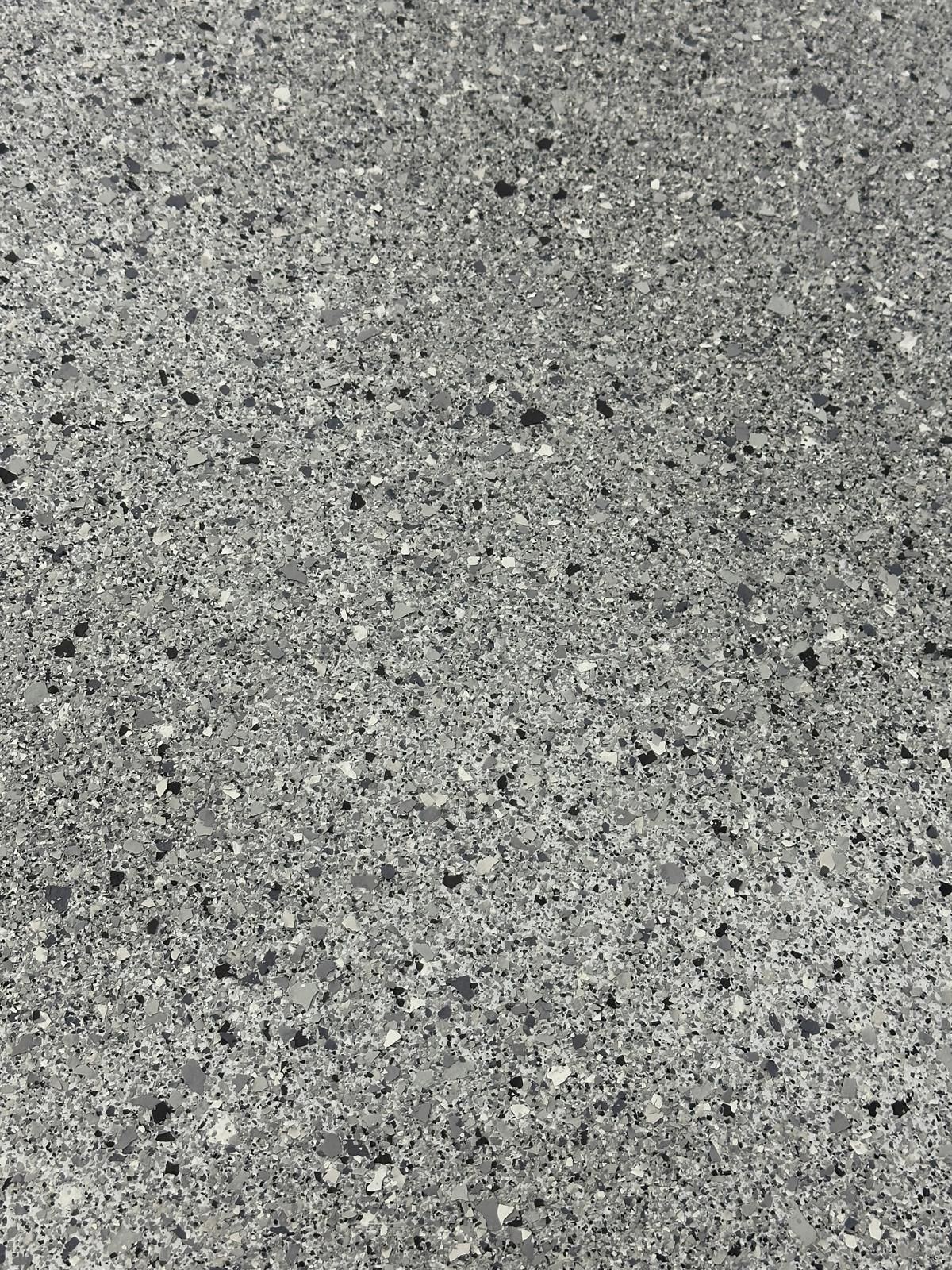 A close up of a gray granite counter top.