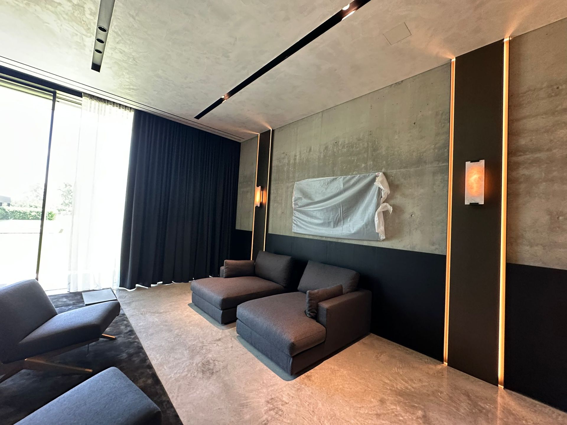 A living room with a couch and chairs in it