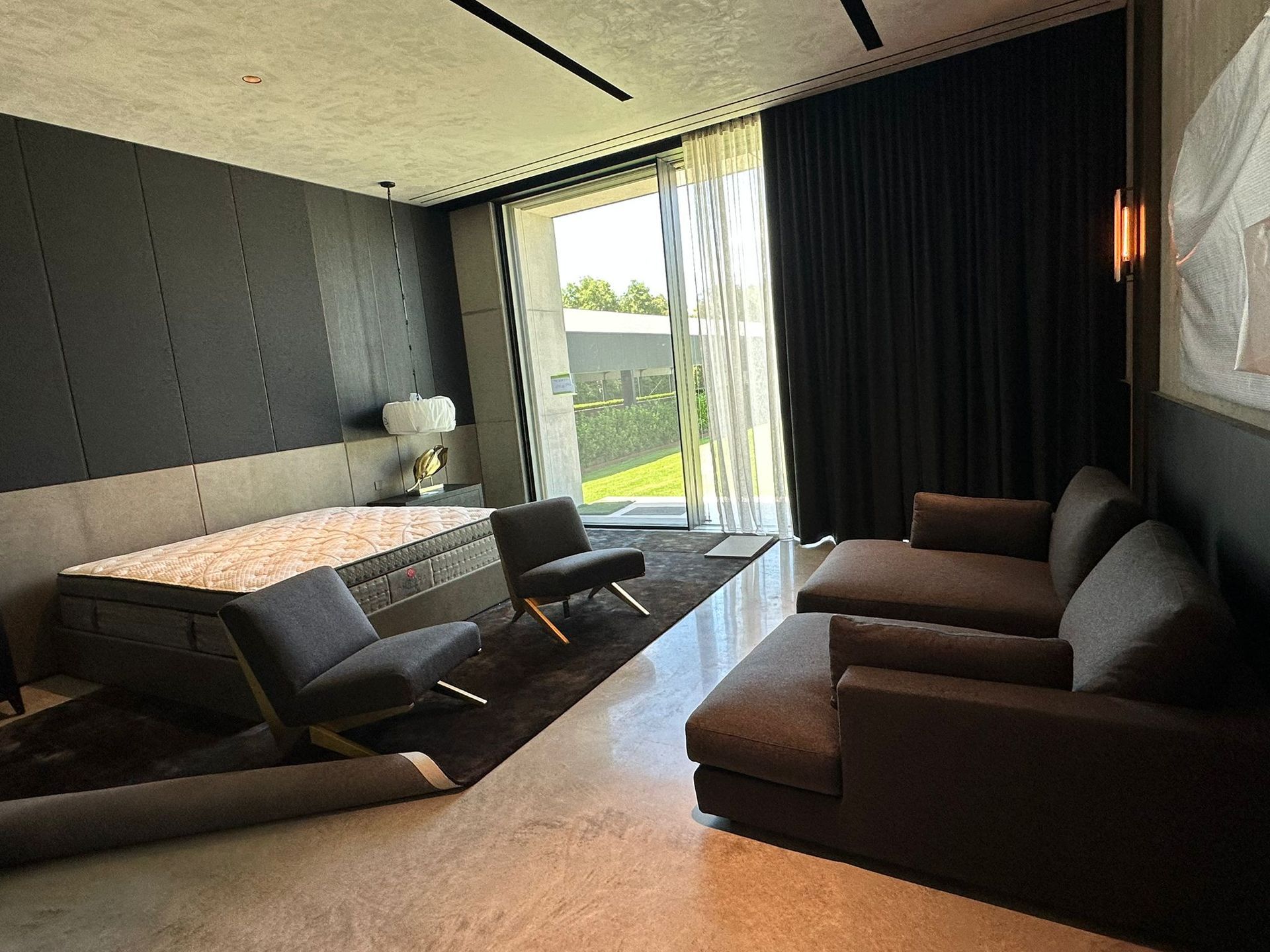 A living room with a couch , chairs , and a bathtub.