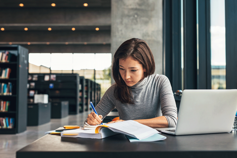 girl studying at library