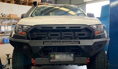 White Ford Vehicle in Workshop — 4WD Gear in Noosaville, QLD