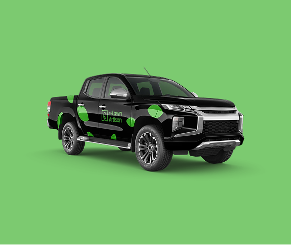 A black pickup truck with green branding on the side against a solid green background.
