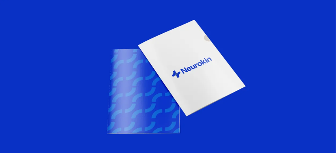 A white folder with a blue logo sits partially on top of a translucent blue patterned sleeve against a solid blue background.
