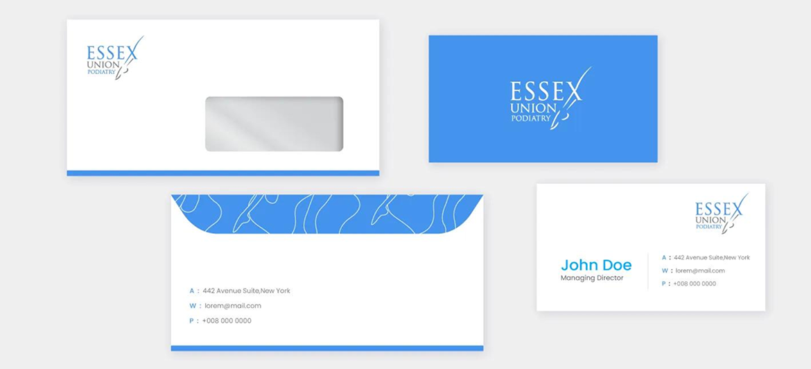 A stationery set for Essex Industrial, featuring white and blue envelopes and a business card with branding.