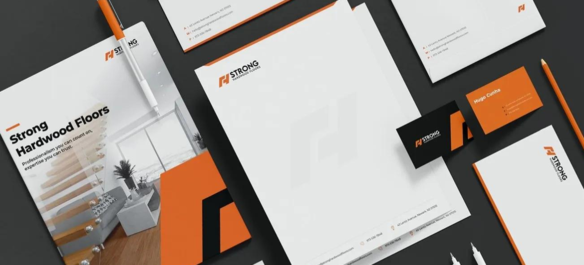 Corporate branding stationery set including letterheads, business cards, and a flyer, featuring an orange and black theme.