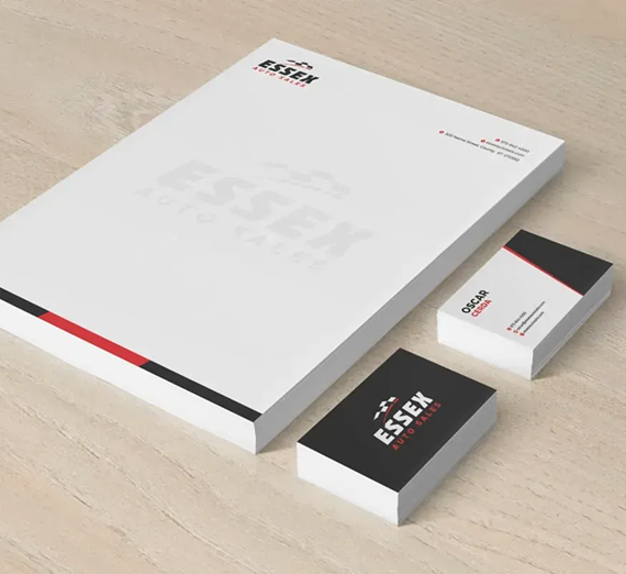 A stationery set for Essex Auto Sales including letterhead and business cards with a white, black, and red branding design.