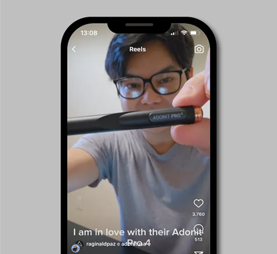 A person holds up an Adonit Pro stylus for a social media reel, with the brand name visible on the black pen body.