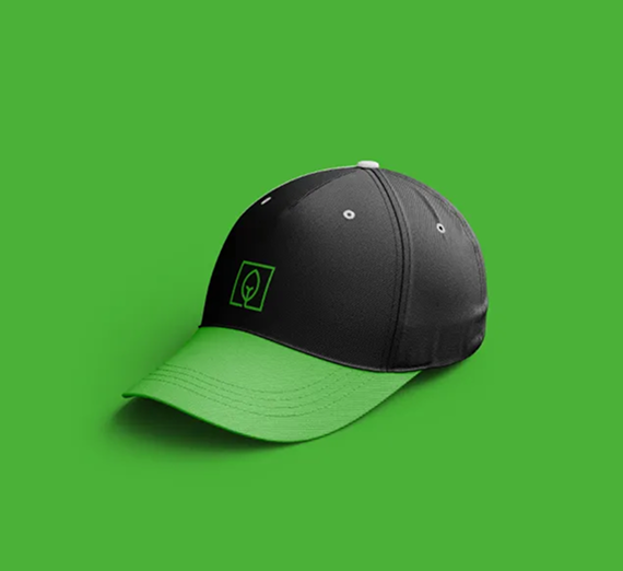 A black baseball cap with a green brim and a square logo, centered on a matching green background.