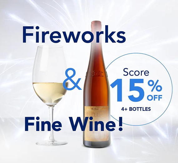 A wine glass and bottle with text advertising 15% off 4 or more bottles of wine for a fireworks-themed promotion.