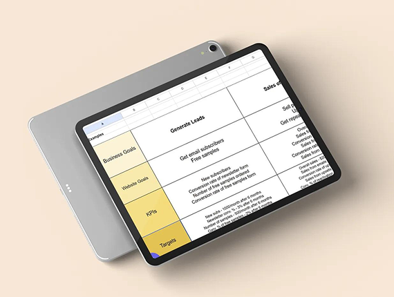 A tablet displays a business strategy table focused on generating leads, set against a plain beige background.