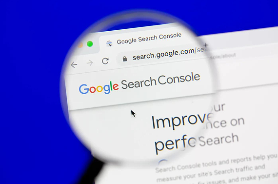 A magnifying glass focuses on the Google Search Console homepage against a bright blue background.