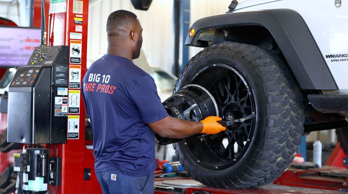 A black object is sitting in a white circle on a white surface.