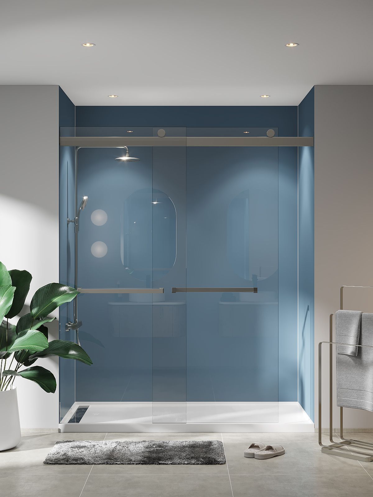 A bathroom with a blue wall and a sliding glass shower door.